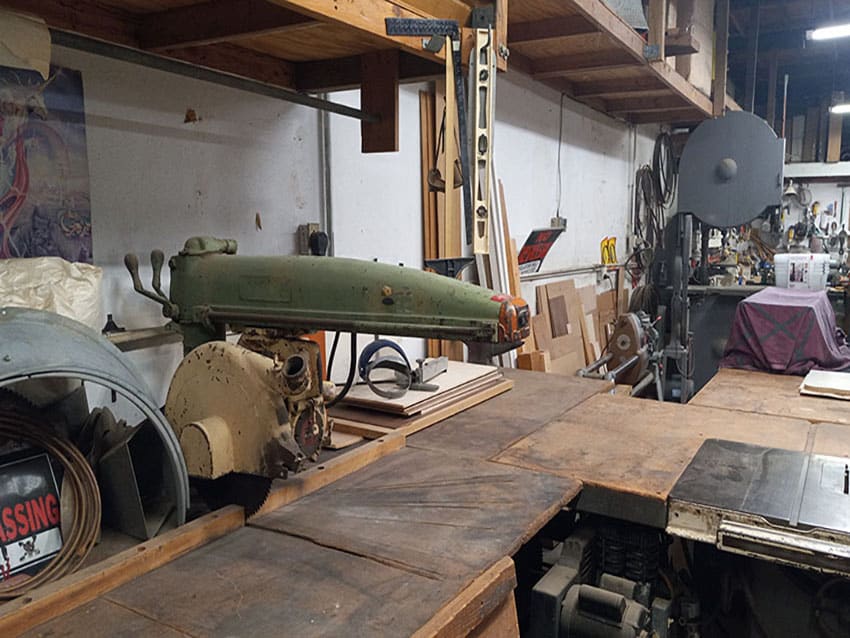 Dewalt 16" Radial arm saw - used for cutting various sizes of wood. To the right 10" Delta unisaw. In the background is a 36" tannewitz band saw.
